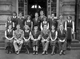 Inverness Royal Academy Prefects 1948-1949. Rear: Peggy MacLeod, Margaret MacLennan, Roderick A. MacLeod, Peggy Fraser, Stanley Fleming, James MacKenzie, Deirdre Munro, Frank Taylor, Ross Martin, Aileen Munro. Front: Erica Donald, Scott Moffatt (VC), Aileen Barr (C), Rector D.J MacDonald, Allan Cameron (C), Lorna Menzies (VC), Angus MacKenzie. See also IRAA_045.