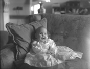 Baby on sofa, inscription 'Aldourie.' (Aldourie was the home of the Fraser-Tytler family). #