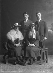 Two couples, portrait, men standing.#   