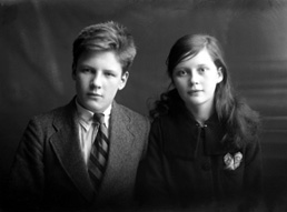 Miss Paterson, Kenneth Street, Inverness. The young man on the left is James Daniel Mackintosh (1905-1970), son of James Daniel Mackintosh (1867-1909) and Christina Christie (1877-1913). At right is his younger sister Maisie (1907-1920). After their parents died they were taken in at different times by several different relatives, including his mother's sister Anne, who had married Peter Paterson. James Daniel Mackintosh emigrated to the USA in 1923, after Maisie died in 1920. Peter Paterson was the brother of famous photographer Andrew Paterson (1877-1948), who also emigrated with wife Anne and daughter Dorothy in 1925. 