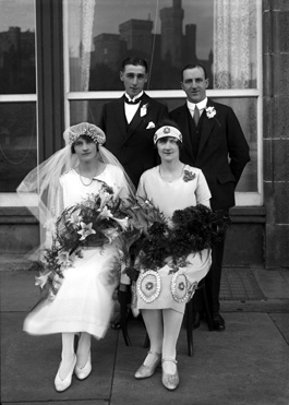 Mackenzie wedding group, from Aultbea, with reflection of Inverness Castle in the windows of the Columba Hotel. 