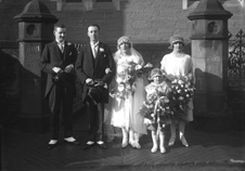 Sinclair - Sutherland bridal group outside Ness Bank Church. The stone plinths still remain after recent renovations to comply with the requirements of the Disability Discrimination Act for access to the Church.