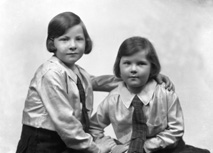 Two young girls, possibly sisters. #