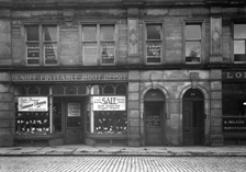 Dundee Equitable Boot Depot (established 1867), Academy Street, Inverness. The business was renamed DE Shoes, but vacated the premises in 2013.  * 