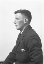 Man wearing suit in profile.#