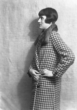Woman in fur collar, check pattern coat.#