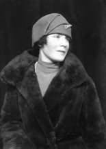 Woman portrait in hat and fur coat. #