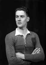 Portrait. The badge on the sports shirt shows a cat and a stag's head. #