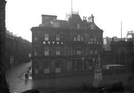 Royal Hotel Inverness, Academy Street, showing vintage car and bus, and Cameron Monument in Station Square, in the rain. Now occupied by the Clydesdale Bank. Monument to Queen's Own Cameron Highlanders who died in Egypt and the Nile campaign 1882-1887. Made from Portland stone it was unveiled in 1893. 04.12.1930.*