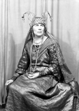 Actress Nelly Hutin Britton was born on 24th April 1876 in Bucklebury, Berkshire. Famous for her Shakespearean roles, she debuted in 1901 in 'Henry V.' She also played Hero in 'Much Ado About Nothing' (1903), Ophelia in 'Hamlet' (1909), Lady Elizabeth in 'Richard III' (1909) and Lady Macbeth at Stratford (1911). In 1903 she married famous actor Matheson Lang, and thereafter they appeared together frequently on stage and later on film. In 1906 she played Arganthael in 'Tristram and Iseult' at the Adelphi Theatre, with Lang as Tristram. Britton and Lang subsequently formed their own company, which toured India, South Africa and Australia from 1910-13 performing Shakespeare. Her roles included Katherine in 'The Taming of the Shrew,' Portia in 'The Merchant of Venice,' Juliet in 'Romeo and Juliet,' as well as reprising the roles of Ophelia and Lady Macbeth. She also appeared with Lang in 'Mr Wu,' which became his signature role. In 1916 they appeared together in a silent film of 'The Merchant of Venice' in which she once again played Portia. She also joined her husband in the film 'The Wandering Jew' (1923) playing the part of Judith. After a four-year illness and a temporary retirement, she returned to the Old Vic stage in 1923 for the Shakespeare Birthday Festival and the following year as Volumnia in 'Coriolanus,' and continued to act until she retired in 1936. In 1940 the Langs were staying with their old friend Dornford Yates and his wife at their house near Pau in France when France surrendered, and they had to escape from the advancing Germans through Spain to Portugal. In later life she sat on the governing board of the Old Vic Theatre. She died on 3rd September 1965 aged 89. These promotional shots were probably taken for the Inverness performance of 'The Wandering Jew' in October 1936, which played to a packed house for several days at the Empire Theatre.