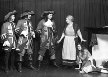 Theatrical actors dressed in costume. #