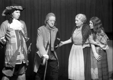 Theatrical actors dressed in costume. #