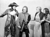 Theatrical actors dressed in costume. #