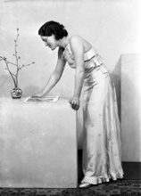 Woman standing reading. #