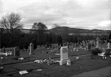 Unidentified cemetery. The centre white headstone is for Margaret MacRae (d.1922), wife of Jacob Matheson and their daughters Catherine Ann and Mary.*