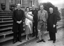 Group on steps, at time of baby christening.# 
