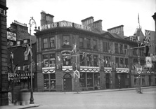 The Norwich Union building, Union Street, Inverness, bedecked with King George VI Coronation decorations, May 1937. Photo taken from Station Square, the first floor signage today reads Norwich Union-Scottish Union Insurance Group. The corner florist on the ground floor is now Santander.* 