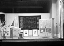 Mr MacAvoy's show window for the May 1937 Coronation of King George VI, complete with portraits of the Princesses Elizabeth and Margaret, and sailing motifs.* 