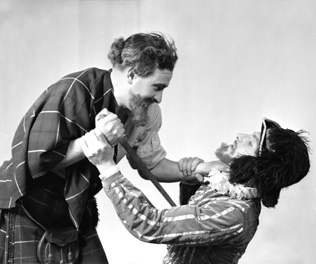 Sorrell vs MacKinnon. Stage actors in costume posing for publicity shots. See also 31334a to 31334c. Man wearing hat is believed to be Henry Christie Landon Sorrell, involved in local amateur dramatics, and manager of the Inverness Repertory Company in 1937 and of the Little Theatre in Inverness, taking over from Ronald Macdonald Douglas in August 1938. (Born 1911 in Endon).