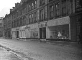 Benzies in Union Street, Inverness. Located there until 1957, the building is now occupied by the British Heart Foundation Furniture and Electrical store and Rogerson Footwear on the right.* 