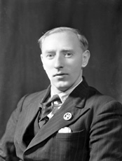 M. Earles, Newfoundland, Edderton. He is wearing a  World War II Newfoundland Forestry Unit, 3rd Inverness Battalion, Scottish Home Guard Badge. These silver plated badges, worn in the field service cap or as mufti lapel badge are now very rare. See also 38442_power.