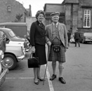 Caption states 'Betty with grandpa Matheson.' In the car park of what is now Farraline Park Bus Station, Inverness.