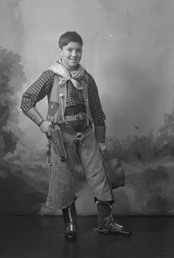 Andrew Chalmers dressed in a cowboy costume for a fancy dress party c1947. (see also refs: 33898, 39550 and 45474). He was a grandson of the famous photographer Andrew Paterson (1877-1948).