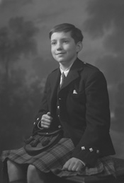 Andrew Chalmers dressed in school uniform for Sundays at the Loretto Boarding School, Edinburgh. (see also refs: 33898, 39550 and 45474). He was a grandson of the famous photographer Andrew Paterson (1877-1948).