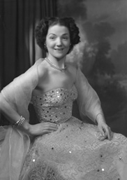 Miss Cairns, Station Hotel, Inverness, in ball gown, seated. Other images also under code 42904.