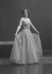 Miss Cairns, Station Hotel, Inverness, in ball gown, standing. Other images also under code 42904.