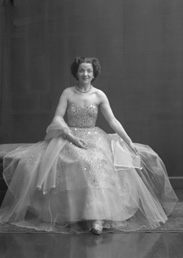 Miss Cairns, Station Hotel, Inverness, in ball gown, seated. Other images also under code 42904.