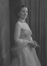 Miss Cairns, Station Hotel, Inverness, in ball gown, standing. Other images also under code 42904.