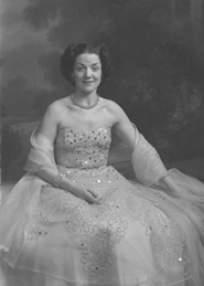 Miss Cairns, Station Hotel, Inverness, in ball gown, seated. Other images also under code 42904.