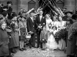 Bridal procession with Scouts and staffs. Possibly taken outside the old West Church in the late 1930s. The leader on the right of the guard of honour is John R. Cowieson, Scoutmaster of the 3rd Inverness (Crown) Troop from 1936. He moved to Fife in the late 40s-early 50s and was District Commissioner and County Commissioner there for a number of years. #