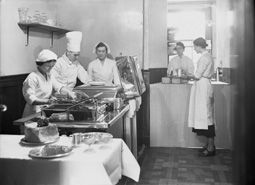 Kitchen interior and caterers, possibly within a hotel/restaurant.*