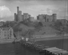 Temporary bridge building Jul-Aug 1939, showing Inverness Castle and Castle Tolmie in background. (Ness Bridge was finally demolished in 1959).* 