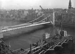 Building temporary bridge over the River Ness in 1939.*