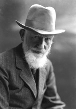 George Bernard Shaw (1856-1950) was an Irish playwright and a co-founder of the London School of Economics. He wrote more than 60 plays and is the only person to have been awarded both a Nobel Prize in Literature (1925) and an Oscar (1938), for his contributions to literature and for his work on the film 'Pygmalion' (adaptation of his play of the same name). In 1898, Shaw married Charlotte Payne-Townshend whom he survived. They settled in Ayot St Lawrence in a house now called Shaw's Corner. In 1925 he was staying in Thurso; having been ill his wife had taken him to Caithness and then to Orkney for his convalescence, and it is probable this image dates from that time. Shaw died in Ayot St Lawrence, aged 94, from chronic problems exacerbated by injuries he incurred by falling from a ladder.