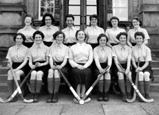 Hockey 1st XI 1956-1957. Rear: Winnifred Elliot, Elizabeth Mann, Margaret Rankine, Maureen Bruce, Margaret Ferguson, Anne Richards. Front: Shona Gorman, Shonaid Robertson, Ishbel Cameron (C), Miss Maude Yule, Pat Cumming (VC), Marion Renfrew, Patricia Urquhart. (Courtesy Inverness Royal Academy Archive IRAA_002).