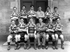 Football 1st XI 1948-1949. Rear: Leslie Hodge, Prefect Frank Taylor, School Captain Allan Cameron, Alex MacAskill, Angus MacKenzie, William Corbett. Front: Alastair Jamieson, Prefect Roderick J. MacLeod, Roland MacKenzie, Mr Cunningham, Lachlan Russell, Louis Forrai. (Courtesy Inverness Royal Academy Archive IRAA_013).