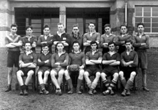 Rugby 1st XV 1943-1944. Rear: A.J McLaren, J.G McPhee, R.L McKenzie, Spencer Marr, Mr C.J Buchanan, Donald MacLennan, Alex J. Graham, Hamish Gray, Craig MacIntosh. Front: G. Reid, James Nairn, Deverell Neill, Callum MacAulay, Bobby McKinlay, Stanley R.  Hone, David G. Watson. (James Cattell not present). (Courtesy Inverness Royal Academy Archive IRAA_032).