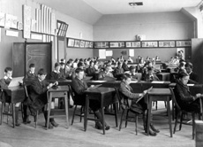 Inverness Royal Academy Large Art Room, Room 25, 1912. Between 1895-1980 the IRA was located in the Midmills building, currently the UHI-Inverness College (2013). The classroom scene was photographed at the time of the completion of the first extension to the Academy, running along Midmills Road opposite the side entrance to the Crown Church. The accommodation was shared in the early years with Inverness High School, when that school occupied the building which now houses the Crown School, only a short distance away. Accommodation included rooms for science and art, with a gymnasium and these are 'posed' publicity shots. This image was captioned Large Art Room of J.A.L Kennedy, Art Master, in the Highland Times, 2nd July 1914.(Courtesy Inverness Royal Academy Archive IRAA_055).