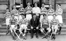 Shinty 1949-1950. Rear: William MacKenzie, James Griffiths, Tom Hay, George MacKenzie, Harry MacKenzie, Walter Bullock, Ross Martin, Donald MacKenzie. Front: Malcolm Fraser, Hugh Fraser,      Mr Stuart, Alistair MacInnes, Rod Norman MacSween. (Courtesy Inverness Royal Academy Archive IRAA_063).