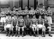 Rugby 1st XV 1951-1952. Rear: Maurice Love, Alistair MacBeath, James Griffiths, Ronald Leishman, Ian Notman, Will Cameron, John Brown, Alistair MacDiarmid, Arthur Griffiths. Front: James Cameron, Sandy Sanderson, Donald W. Fraser (C), Mr Murray, Garry MacNaughton (VC), Alistair MacPherson, Donald Robin. (Courtesy Inverness Royal Academy   Archive IRAA_073).