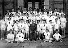 Inverness Royal Academy Athletics 1953-1954. Rear: A. Livingstone, J. Robertson, J. Taylor, C. Ross, R. Paterson, William Ford, J. MacLellan, I. Robin, D. Moir, K. Burrell, A. Finlayson. Middle: J. MacMillan, K. Gardener, D. Murray, I. Nicol, I. Rose, D. Robin, J. Campbell, J. Wylie, A. Sinclair, J. Urquhart, E. Farquhar, J. Cameron. Front: J. MacGillivray, D. Duncan, A. Robertson, A. MacLeod, A. Sinclair, Mr Murray, P. MacLeod, D.E MacLean, D. Lamont, D. Steele, D. Hamilton. (Courtesy Inverness Royal Academy Archive IRAA_079).