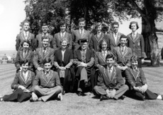 Inverness Royal Academy Prefects 1954-1955. Rear: Ian Robin, Robert Cameron, Iris More, Andrew Matheson, Mary Porteous, John Urquhart, Beatrice MacPherson. Middle: Mary Brown, Ian Philip,  Miss E. Forbes, Rector D.J MacDonald, Maureen Eunson, Alastair MacLeod. Front: Irene Davidson, Ian MacPhee, Robert Dewar, Chrisalda MacKay.  (Courtesy Inverness Royal Academy Archive IRAA_087).