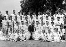 Inverness Royal Academy Athletic team 1954-1955. Rear: Alasdair Finlayson, Ian Philip, Carol Robertson, Alec Paterson, Ishbel Cameron, Kenneth Gardener, Joan Marshall, Roderick MacKenzie, Winnifred Elliot, William Stoddart, Donald Campbell. 2nd row: John Urquhart, James Pennan, Marion Renfrew, Ian Robin, Maureen Bruce, James Wylie, Seumas MacInnes, Helen Simpson, Ian Nicol, Catherine MacInnes. 3rd row: Peter English, Margaret Sinclair, John MacLellan, Dorothy Lamont, Mr Murray, Alastair MacLeod, Sheena Campbell, John Robertson, Isla Rose, William McGuire. Front: Margaret Campbell, Ross Henderson, Winona Duncan, Douglas Thomson, Shona Robertson. (Courtesy Inverness Royal Academy Archive IRAA_091).