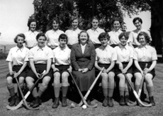 Hockey 1st XI 1954-1955. Rear: Shonaid Robertson, Maureen Bruce, Ishbel Cameron, Sheena Campbell, Joy Fraser, Dona Finlayson. Front: Marion Renfrew, Dagmar Liebmann, Margaret Sinclair, Miss Maude Yule, Isla Rose, Jean Stoker, Elizabeth Grant. (Courtesy Inverness Royal Academy Archive IRAA_094).