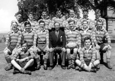 Rugby 1st XI 1954-1955. Rear: Donald MacLeod, John Watson, Jack Bosworth, Ian Boag, David Moffat, Robert Dewar,  Robert Ewen. Middle: Alastair MacKenzie, Roderick MacKenzie, Alastair MacLeod, Mr Murray, Ian Philip, Ian Robin, John Robertson. Front: Ewen Lawson, Donald Campbell. (Courtesy Inverness Royal Academy Archive IRAA_096).