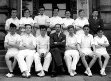 Inverness Royal Academy Cricket Colts 1955-1956. Rear: David Richards, John Summers, Alex MacDonald, Sandy Stewart, Alan Spence, Derick  MacRae, Stewart Fraser. Front: Alex MacDonald, Colin MacLennan, Ian MacDiarmid, Mr Thom, James MacQueen, Roderick MacFarquhar, Raymond MacDonald. (Courtesy Inverness Royal Academy Archive IRAA_107).